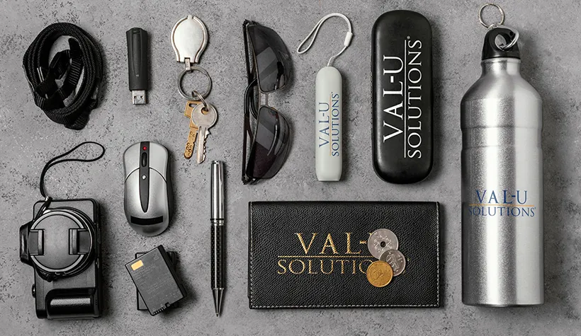 A mock up of branded products containing the Val-U Solutions logo.