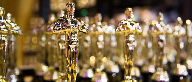 A photo of rows of Oscar Awards.